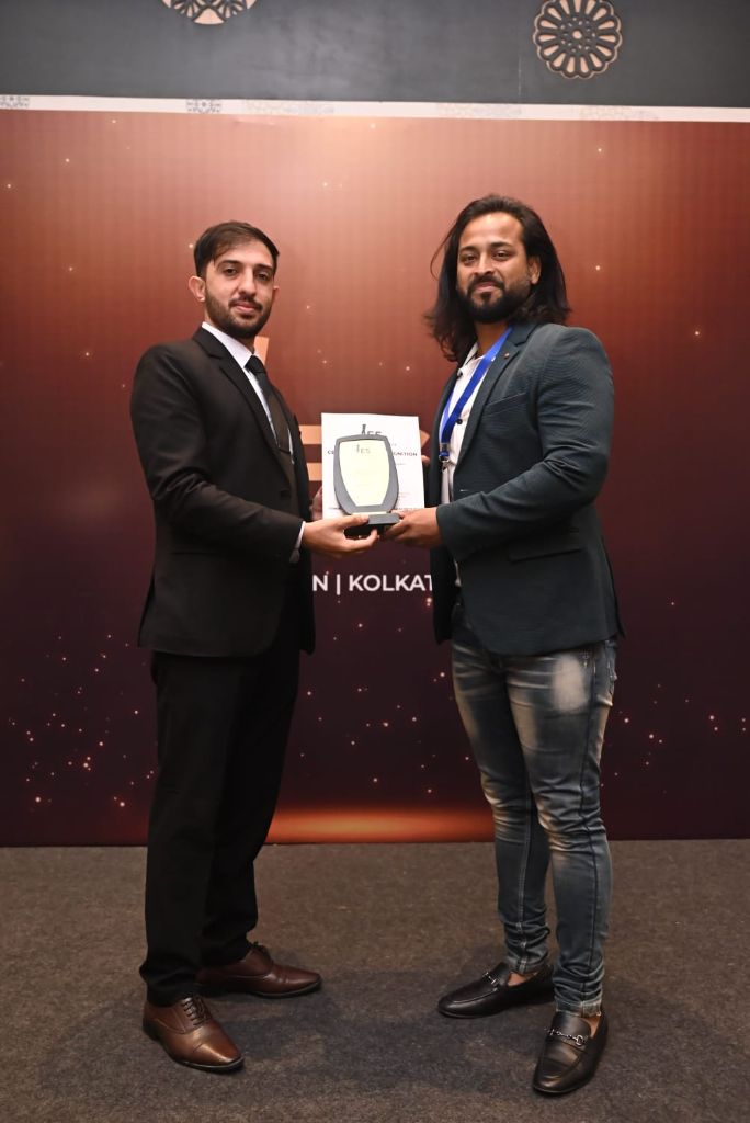 LessonThrills founder Rashed Hossain receiving an award for communication and leadership excellence